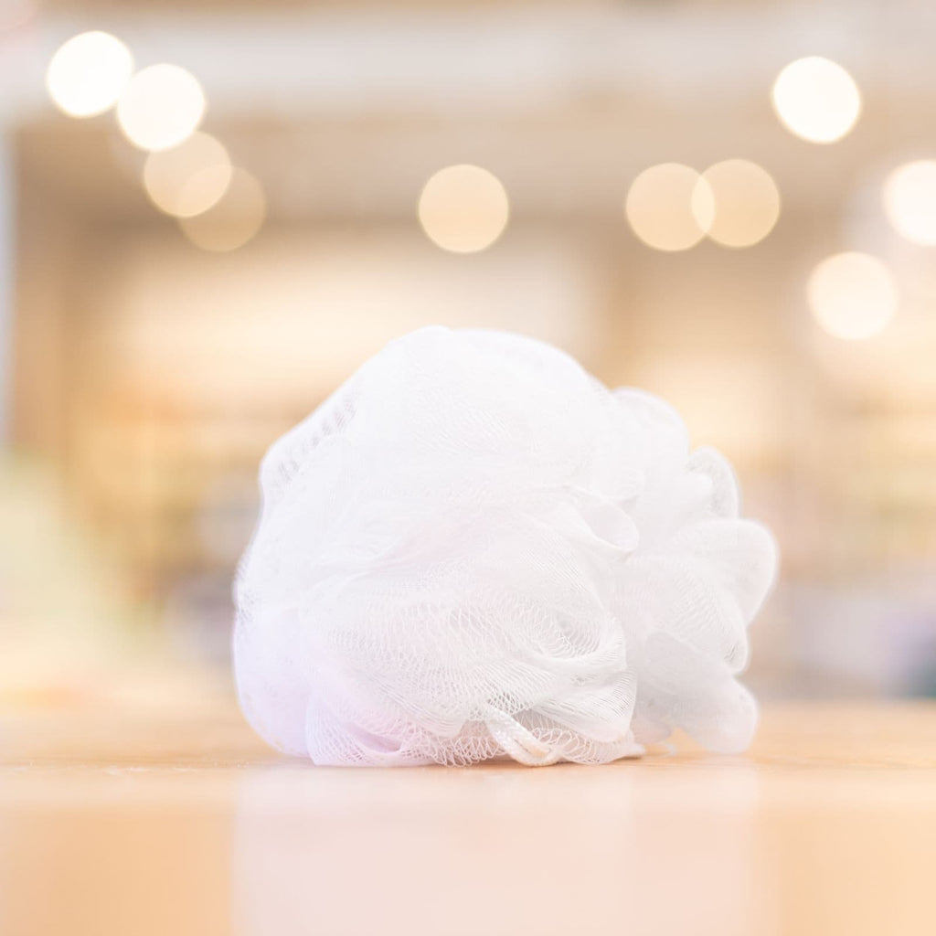 White loofah bath sponge for shower and soap lathering