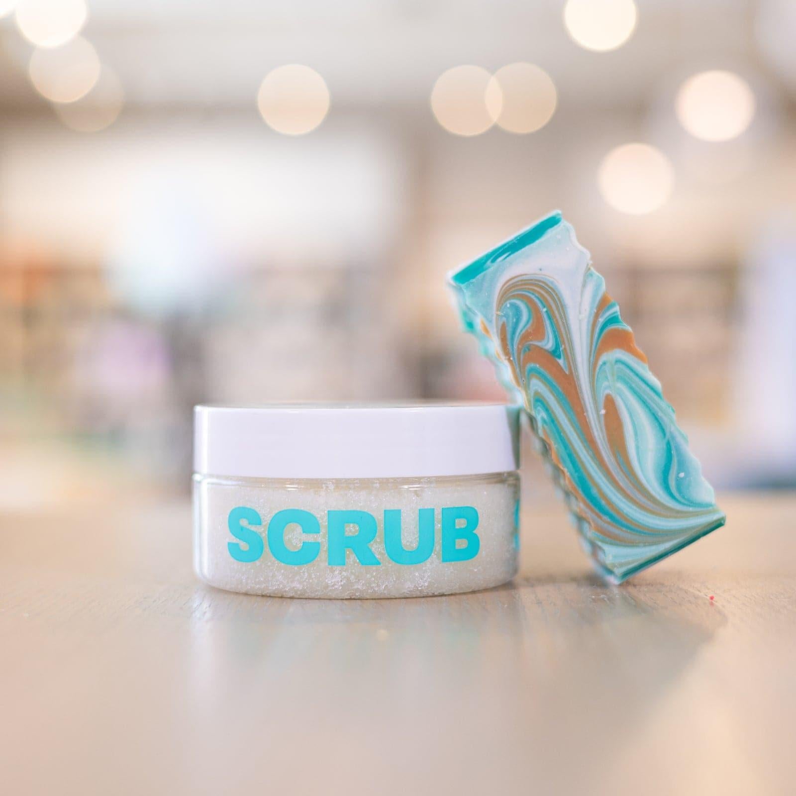 Narcissist Body Scrub with bar of Narcissist Bar Soap leaned against it